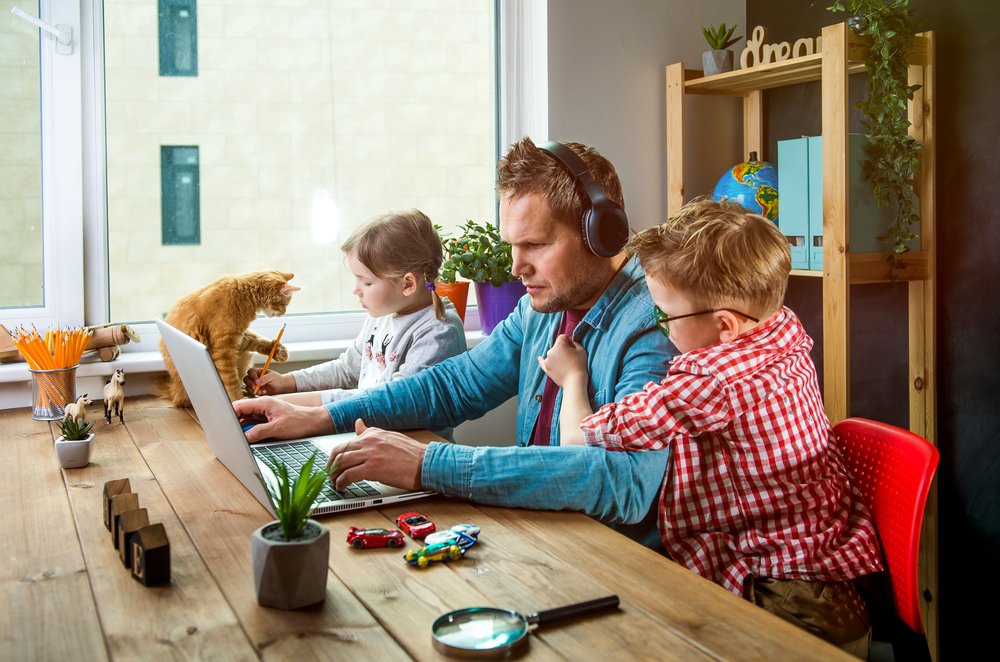 Work from Home Productivity: A father working from home with his children