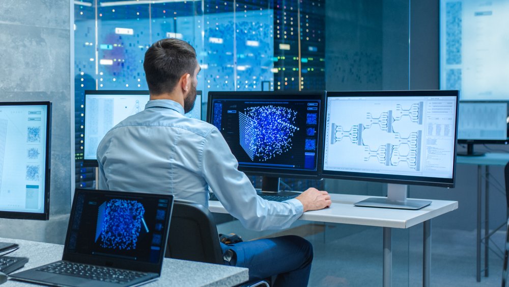 Top Paying Remote Jobs: Male Computer Engineer and Scientists Create Neural Network at His Workstation. 