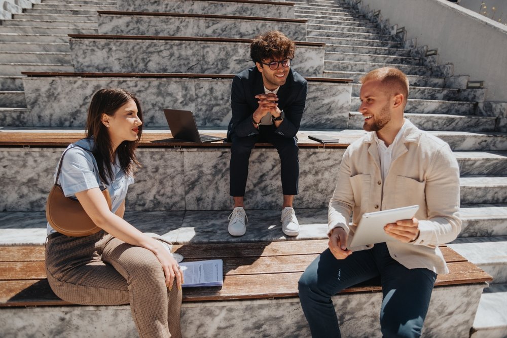 Remote Job Packageivity Hacks: Picture of a remote workers discussing and working positively.