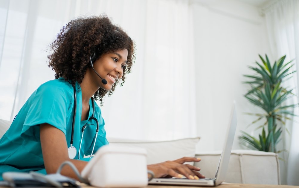 cvs work from home jobs: A picture showing a cvs telehealth nurse working remotely