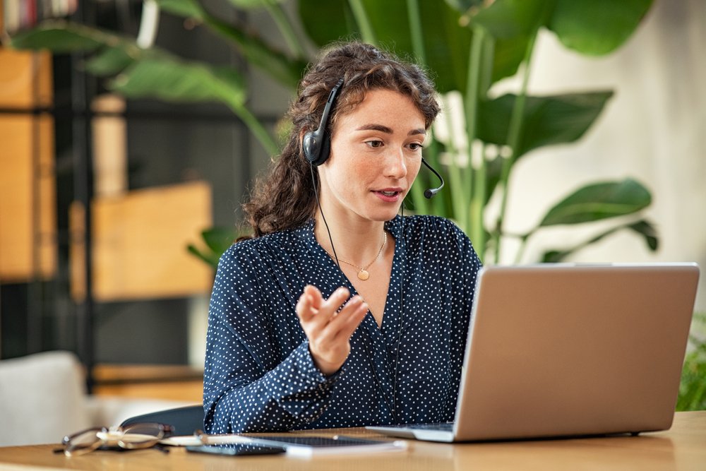 Work from Home Jobs for Women: A picture showing a woman customer service representative working from home.