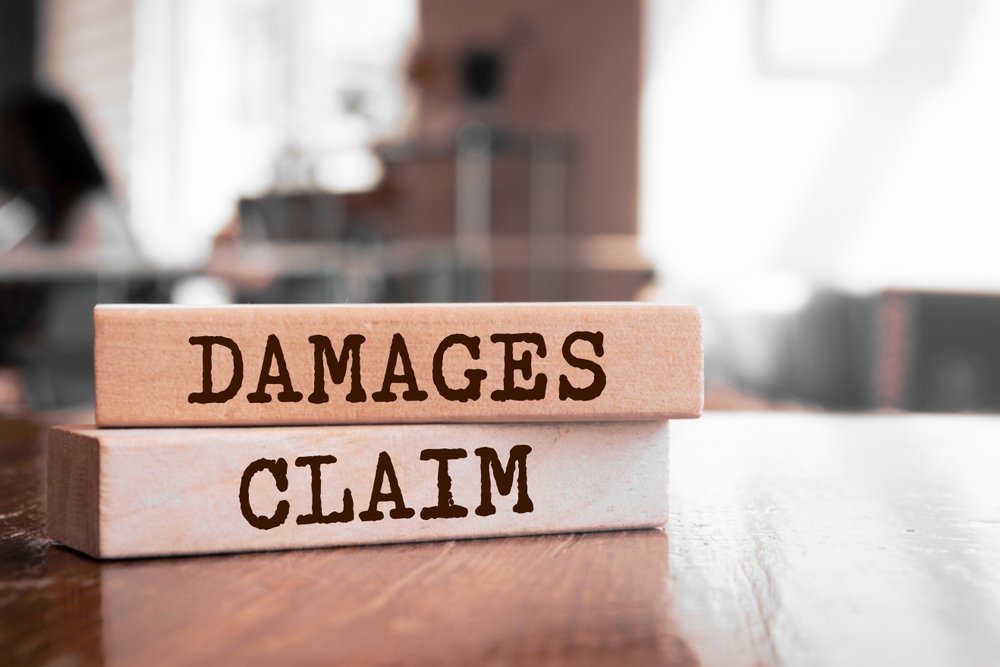 Remote Insurance Jobs: Wooden blocks with words Damages Claim