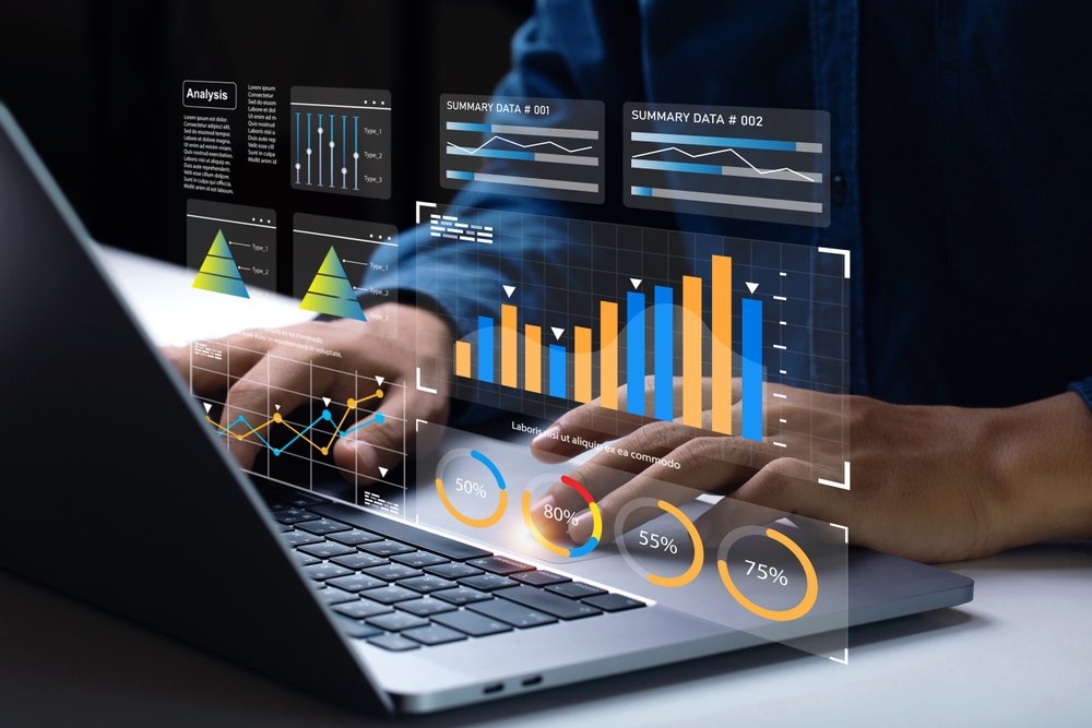 The 5 Best and Worst Remote Jobs for People Who Love to Learn New Skills: Analyst Works on Personal Computer Showing business analytics dashboard with charts, metrics and KPI to analyze performance.