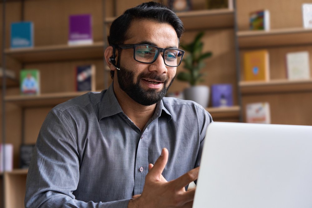 Full-Time vs. Part-Time Remote Jobs: Picture of a male freelancer working on a laptop