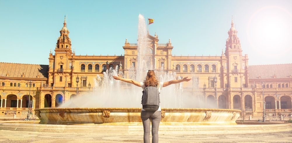 Spanish Digital Nomad Visa: A female digital nomad facing seville plaza