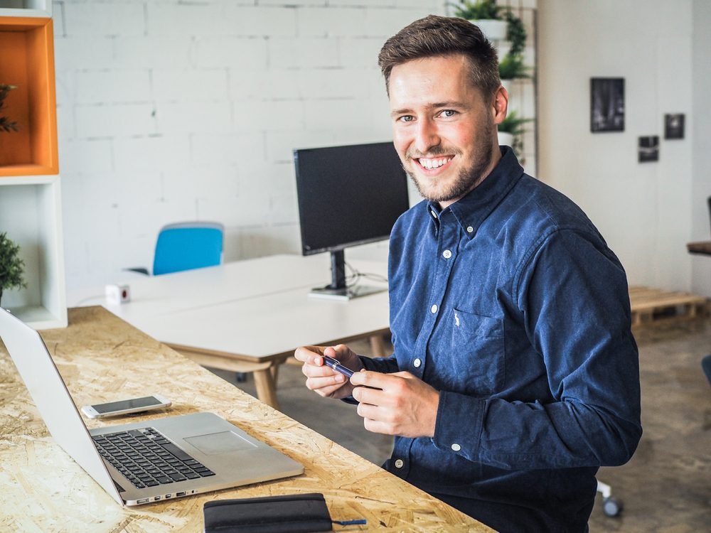 Amazon Career Work from Home: happy smiling remote online working man