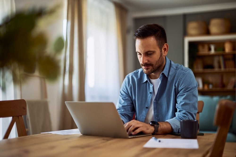Best and Worst Remote Jobs for Work-Life Balance: Picture of a male freelancer working remotely from home