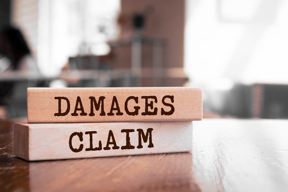 Remote Insurance Jobs: Wooden blocks with words Damages Claim
